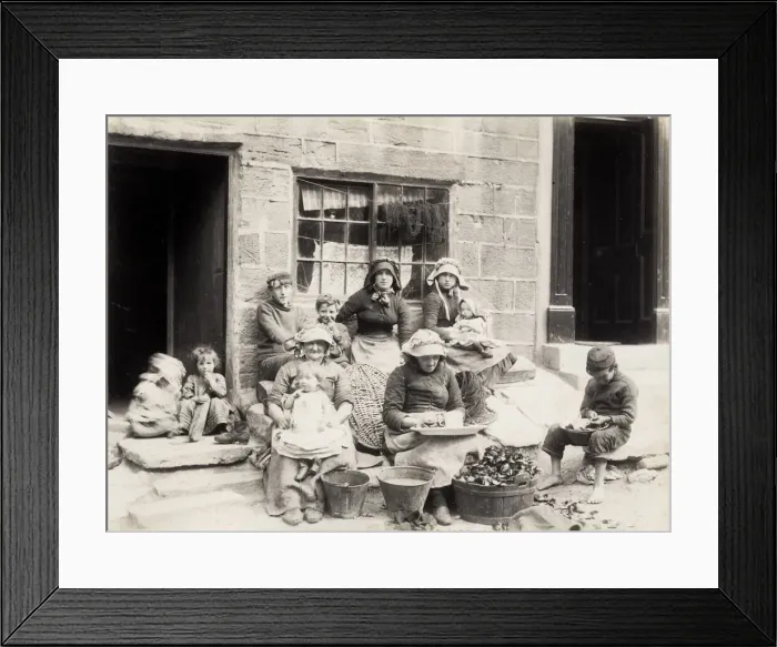Framed Print : Fishing family outside their home in Staithes Yorkshire Framed Print : Fishing family outside their home in Staithes Yorkshire