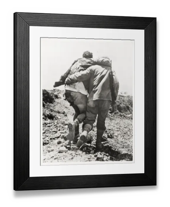 Framed Print : World War II US soldier helped towards the rear Framed Print : World War II US soldier helped towards the rear