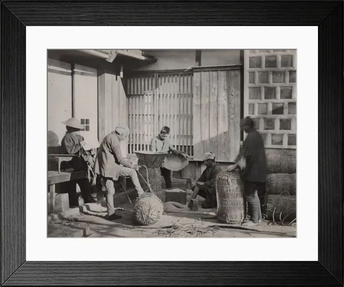 Framed Print : Farm workers packing bales of rice, Japan