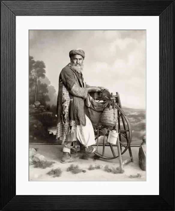 Framed Print : Bearded Egyptian man sharpening knives on grind stone Framed Print : Bearded Egyptian man sharpening knives on grind stone