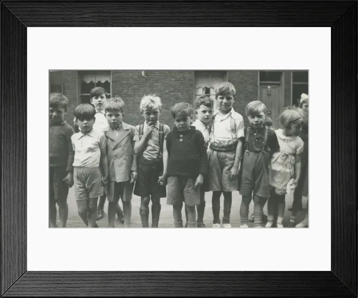 Framed Print : A group of children lined up for a photograph in a terraced street. Date: 1930s Framed Print : A group of children lined up for a photograph in a terraced street. Date: 1930s