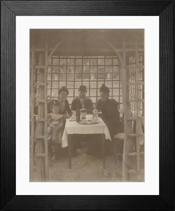 Framed Print : A family, three adults and a little girl, sitting in a rustic Framed Print : A family, three adults and a little girl, sitting in a rustic