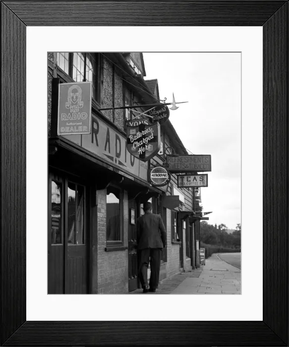 Framed Print : Advertising signs on shops in Hartfield, East Sussex Framed Print : Advertising signs on shops in Hartfield, East Sussex