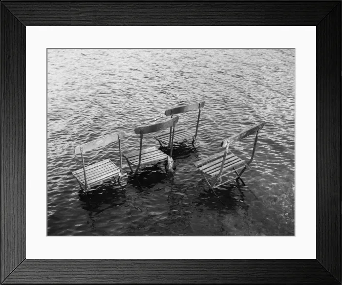 Framed Print : Flooded riverbank with chairs Framed Print : Flooded riverbank with chairs