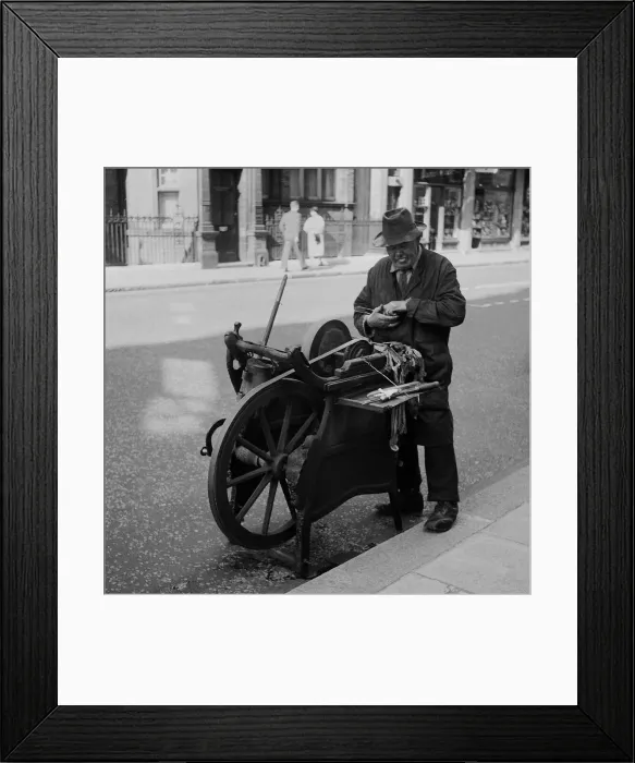 Framed Print : Knife grinder at work, Central London Framed Print : Knife grinder at work, Central London
