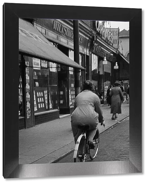 Lady cyclist, Lee High Road, SE London