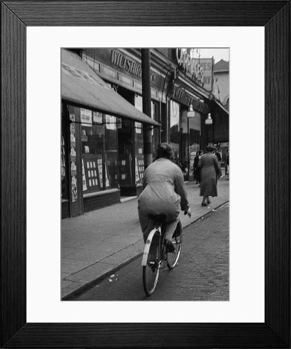 Framed Print : Lady cyclist, Lee High Road, SE London Framed Print : Lady cyclist, Lee High Road, SE London