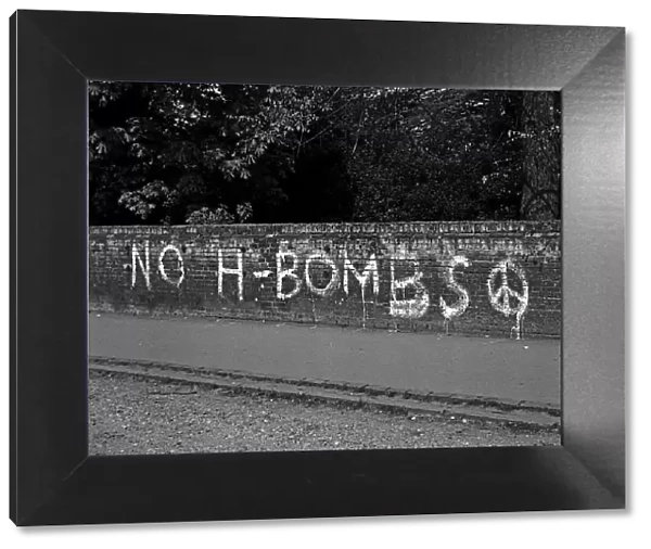 NO H -BOMBS slogan on brick wall