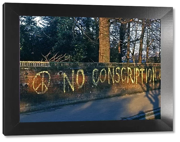 NO CONSCRIPTION painted on wall