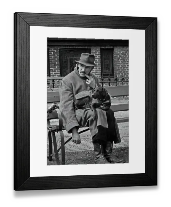 Framed Print : Man and dog resting on a bench Framed Print : Man and dog resting on a bench