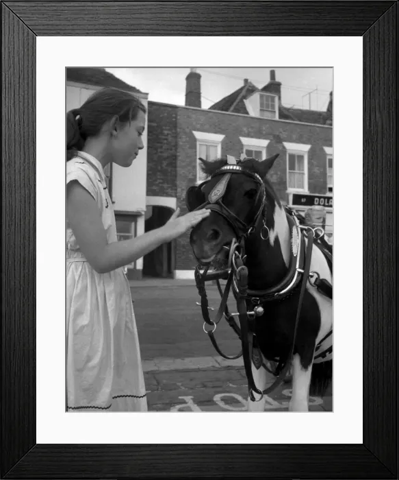 Framed Print : Sugar the pony with young girl at Deal, Kent Framed Print : Sugar the pony with young girl at Deal, Kent