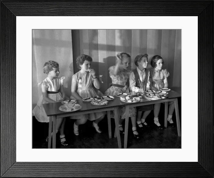 Framed Print : Young girls enjoying food at a party Framed Print : Young girls enjoying food at a party