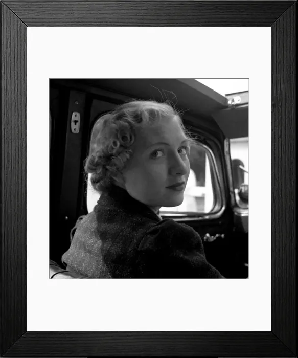 Framed Print : Young woman in car with open roof Framed Print : Young woman in car with open roof