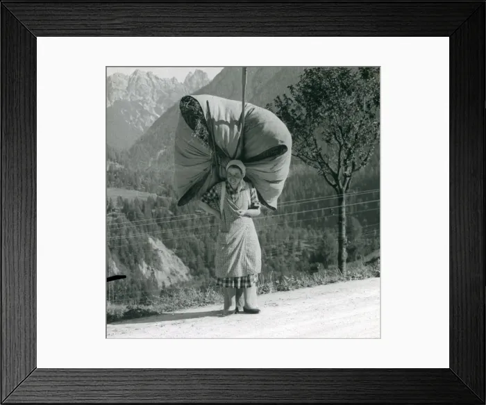 Framed Print : Spanish woman carrying a massive bundle of hay Framed Print : Spanish woman carrying a massive bundle of hay