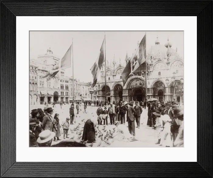 Framed Print : Tourists feeding pigeons in St Marks Square, Venice, Italy Framed Print : Tourists feeding pigeons in St Marks Square, Venice, Italy