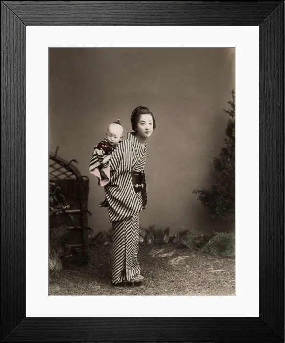 Framed Print : Japan - young nurse carrying a baby Framed Print : Japan - young nurse carrying a baby