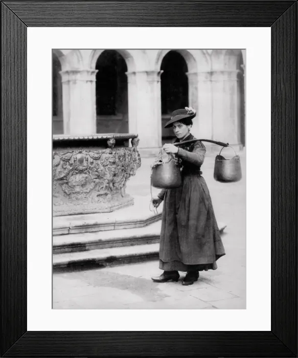 Framed Print : Female water carrier at a well, Venice, Italy Framed Print : Female water carrier at a well, Venice, Italy