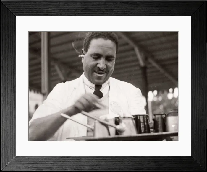 Framed Print : 1943 Egypt waiter serving coffee with cigarette in ear Framed Print : 1943 Egypt waiter serving coffee with cigarette in ear