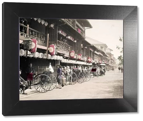 Street filled with rickshaws, jinrikishas, Japan, c. 1890 s