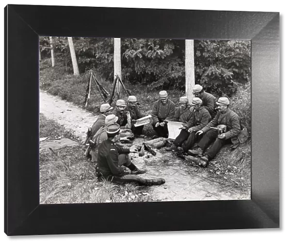 WWI: French soldiers resting by roadside