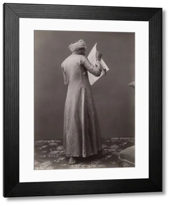 Framed Print : Egyptian man reading a newspaper, c. 1880 s Framed Print : Egyptian man reading a newspaper, c. 1880 s
