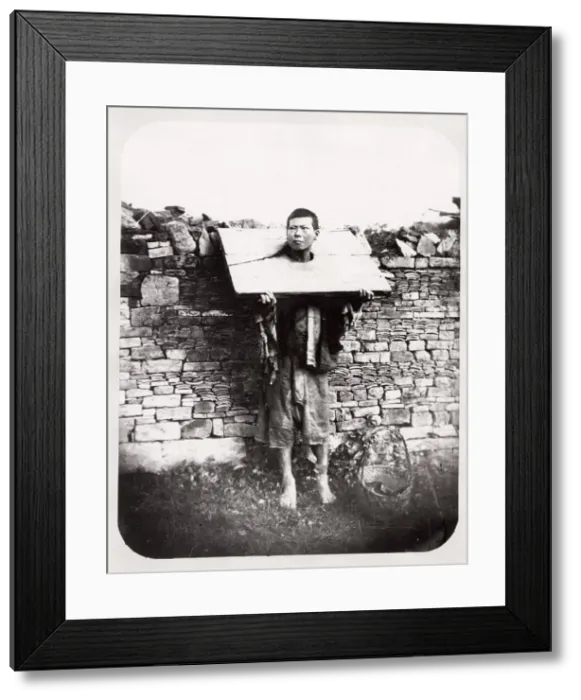 Framed Print : Man in a cangue, stocks, punishement, China Framed Print : Man in a cangue, stocks, punishement, China