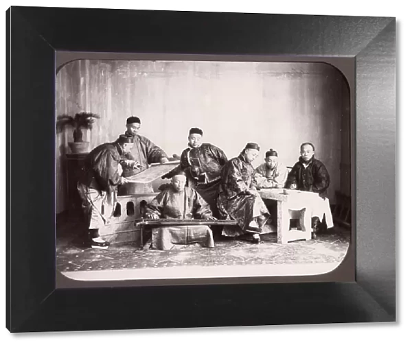 Group of seated Chinese men, musician, China