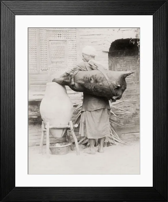 Framed Print : Water carrier with an animal skin container, Egypt Framed Print : Water carrier with an animal skin container, Egypt