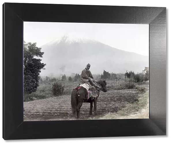 c. 1880s Japan - farmer on his horse near Mount Fuji