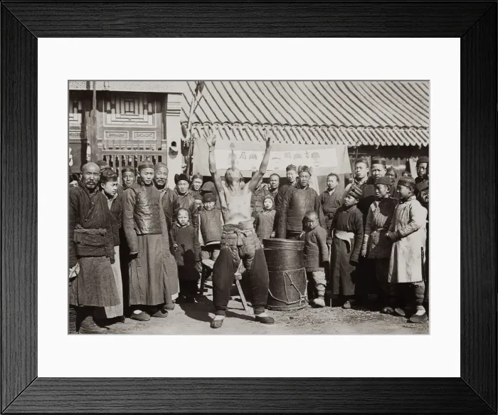 Framed Print : Chines man swallowing a sword, street performer, China Framed Print : Chines man swallowing a sword, street performer, China