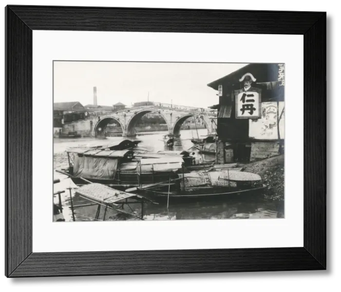 Framed Print : River boats and bridge, China