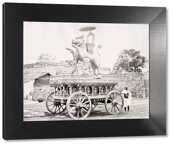 Festival procession car with carved statue, India