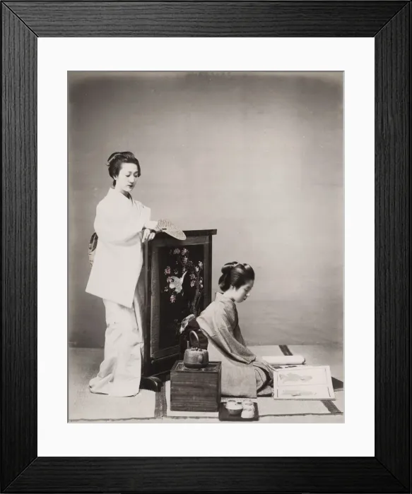 Framed Print : Two geishas, one reading, with stove a tea set. Japan Framed Print : Two geishas, one reading, with stove a tea set. Japan