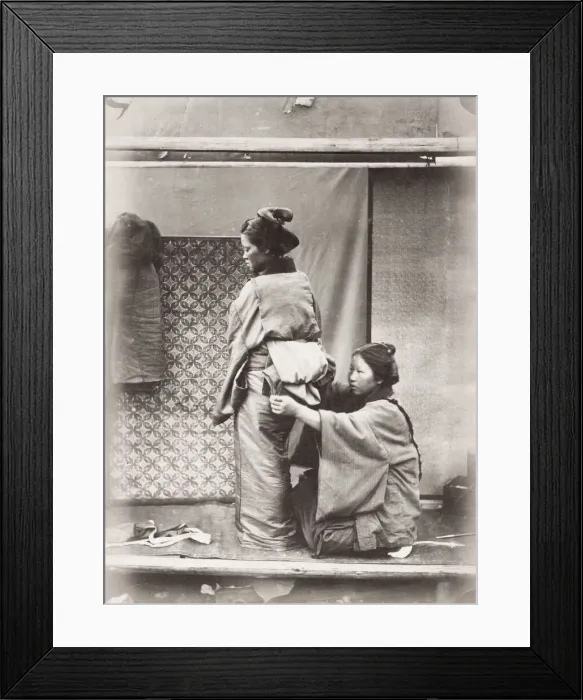 Framed Print : Woman having the obi sash tied over her kimono, Japan Framed Print : Woman having the obi sash tied over her kimono, Japan