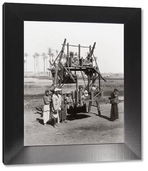 Children on an early funfair ride, Egypt, c. 1890