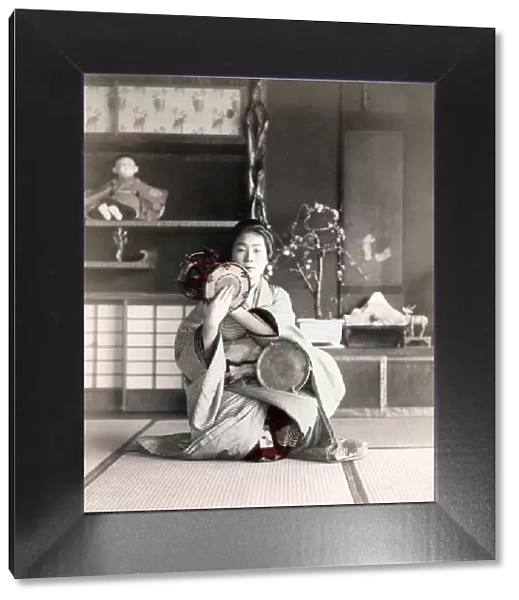 c. 1880s Japan - geisha playing a drum