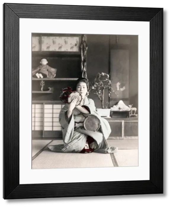 Framed Print : c. 1880s Japan - geisha playing a drum Framed Print : c. 1880s Japan - geisha playing a drum