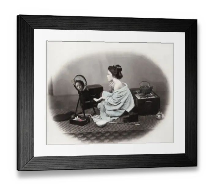 Framed Print : 1860s Japan - portrait of a young woman putting on make-up at a mirror Felice or Felix