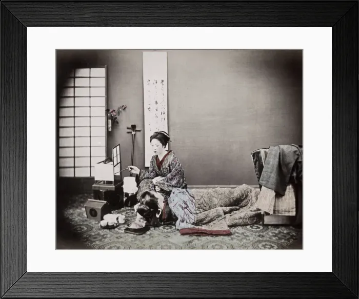 Framed Print : c. 1880s Japan - two geishas, studio scene, shamisen and tea set Framed Print : c. 1880s Japan - two geishas, studio scene, shamisen and tea set