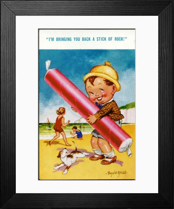 Framed Print : Comic postcard, Boy on the beach with stick of rock Framed Print : Comic postcard, Boy on the beach with stick of rock
