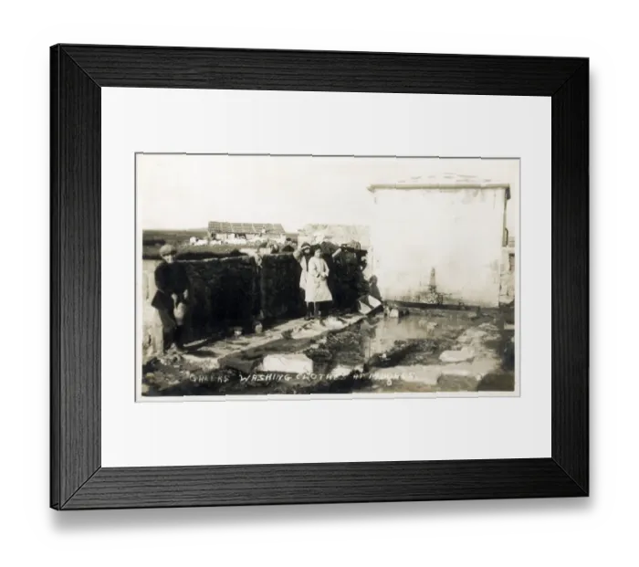 Framed Print : Moudros, Lemnos, Greece - Laundry in the open air - washing clothes by rubbing the garments against large stones and then drying over walls and on fences in the hot sun. Date: 1922 Framed Print : Moudros, Lemnos, Greece - Laundry in the open air - washing clothes by rubbing the garments against large stones and then drying over walls and on fences in the hot sun. Date: 1922