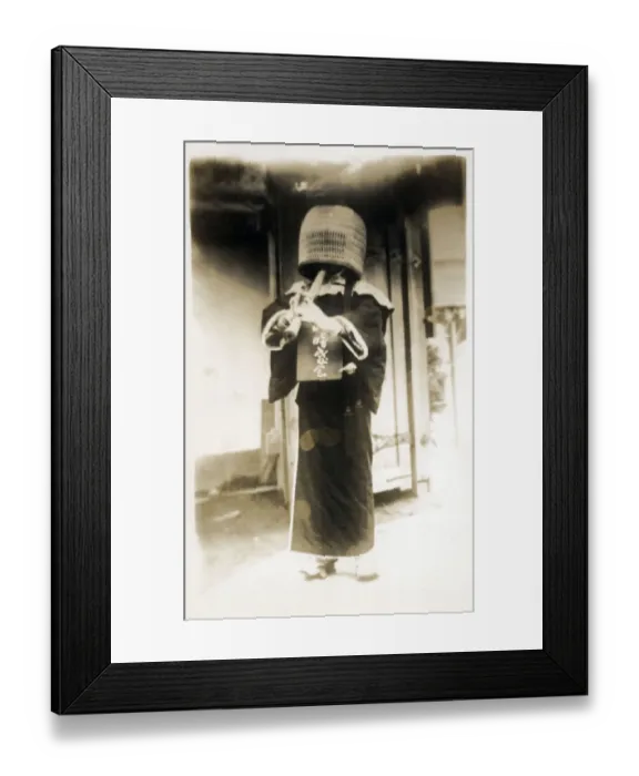 Framed Print : Kobe, Japan - A komuso (monk of the Fuke sect) wearing a basket hat (tengai or tengui) and playing the shakuhachi bamboo flute. Date: 1928 Framed Print : Kobe, Japan - A komuso (monk of the Fuke sect) wearing a basket hat (tengai or tengui) and playing the shakuhachi bamboo flute. Date: 1928