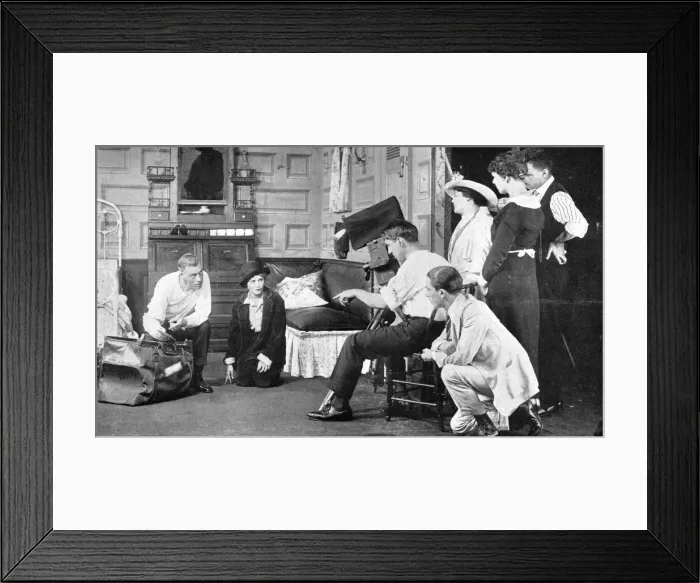 Framed Print : Mary Pickford making a picture (1919). To the left of Pickford with a bag is the director Sidney Scott. Kneeling on the right by the cameraman is Marys brother Jack Pickford Date: 1919 Framed Print : Mary Pickford making a picture (1919). To the left of Pickford with a bag is the director Sidney Scott. Kneeling on the right by the cameraman is Marys brother Jack Pickford Date: 1919