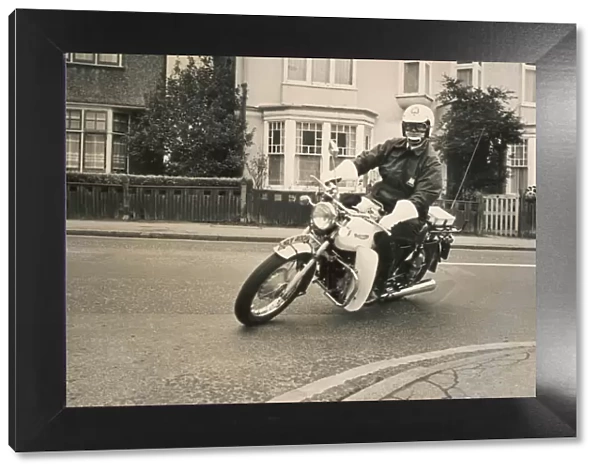 Policeman riding a Triumph motorcyle