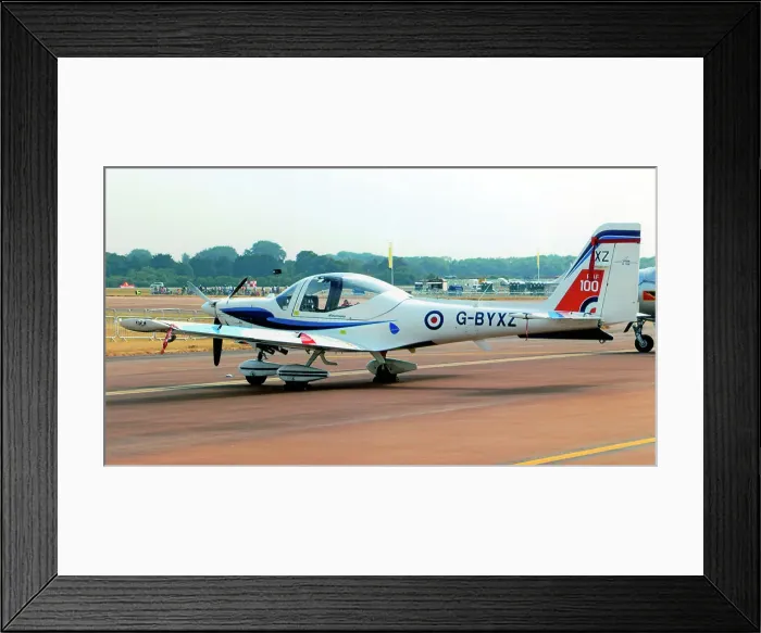 Framed Print : Grob G. 115E Tutor G-BYXZ (msn 82182), of Babcock-HCS, operating the RAF's flight experience and University Air Squadron tasks. Seen at the Royal International Air Tattoo - RAF Fairford 13 July 2018 Date: 2018 Framed Print : Grob G. 115E Tutor G-BYXZ (msn 82182), of Babcock-HCS, operating the RAF's flight experience and University Air Squadron tasks. Seen at the Royal International Air Tattoo - RAF Fairford 13 July 2018 Date: 2018