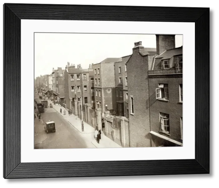 Framed Print : A view of Cleveland Street in the Fitzrovia area of London. The large building right of centre is the Middlesex Hospital out-patients department. It was originally erected in the 1770s as a workhouse for the parish of St Paul Covent Garden Framed Print : A view of Cleveland Street in the Fitzrovia area of London. The large building right of centre is the Middlesex Hospital out-patients department. It was originally erected in the 1770s as a workhouse for the parish of St Paul Covent Garden