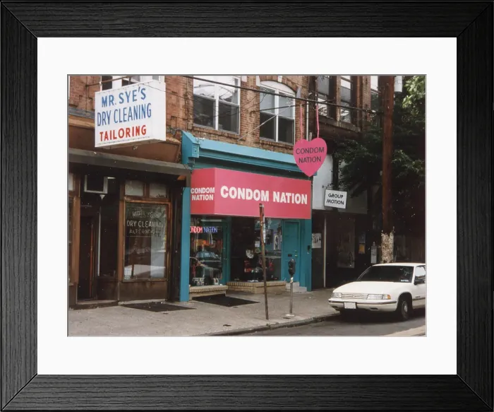 Framed Print : Condom store off South Street, Philadelphia : the variety available ranges from The Immaculate Conception (Mary) to the Stealth Bomber Date: 1992 Framed Print : Condom store off South Street, Philadelphia : the variety available ranges from The Immaculate Conception (Mary) to the Stealth Bomber Date: 1992