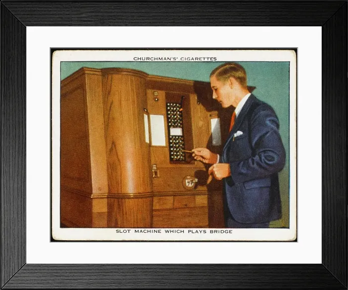 Framed Print : A customer plays an automatic bridge-playing slot machine Date: circa 1937 Framed Print : A customer plays an automatic bridge-playing slot machine Date: circa 1937