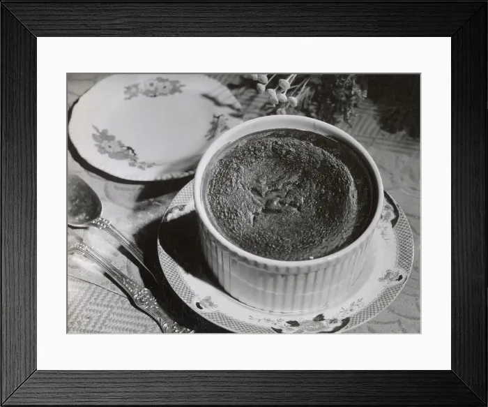 Framed Print : A freshly made chocolate souffle, temptingly and decoratively arranged on a table and ready to be eaten Date: 1930s Framed Print : A freshly made chocolate souffle, temptingly and decoratively arranged on a table and ready to be eaten Date: 1930s