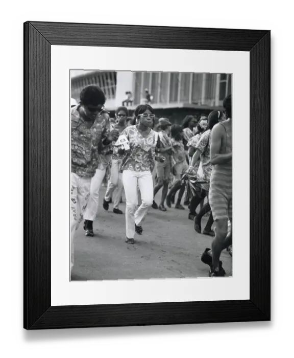 Framed Print : A young woman in trendy sunglasses dances with her friends at the Port of Spain Carnival, Trinidad, West Indies. Date: 1968 Framed Print : A young woman in trendy sunglasses dances with her friends at the Port of Spain Carnival, Trinidad, West Indies. Date: 1968